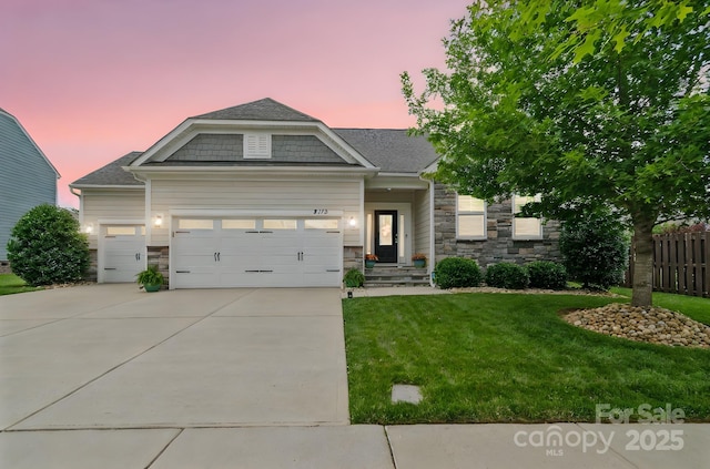 2112 Balting Glass Dr, Indian Trail, NC 28079 - craftsman inspired home featuring stone siding, a garage, concrete driveway, and roof with shingles