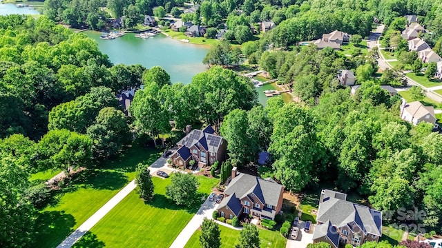 132 Parkside Ln, Mooresville, NC 28117 - aerial overview of property's location with a nearby body of water, nearby suburban area, and a tree filled landscape