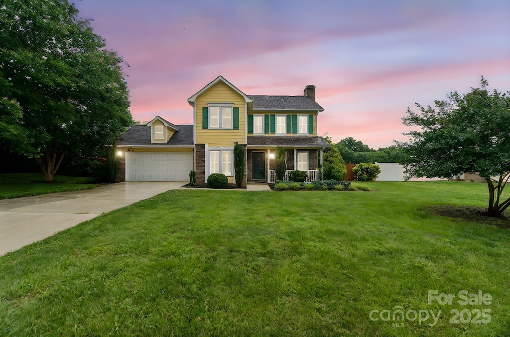 105 Carmel Hills Dr, Gastonia, NC 28056 - traditional-style home with a chimney, concrete driveway, a garage, and a porch