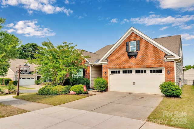 417 Brier Knob Dr, Fort Mill, SC 29715 - traditional-style home featuring brick siding, driveway, roof with shingles, and a garage