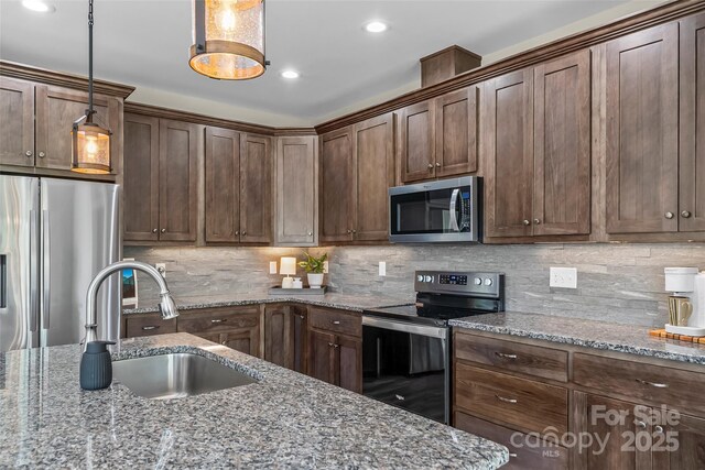 552 High Trail Dr, Nebo, NC 28761 - kitchen featuring appliances with stainless steel finishes, backsplash, recessed lighting, and stone counters