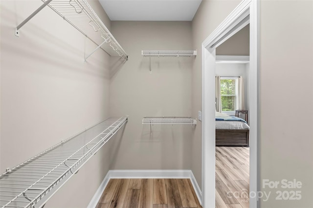 552 High Trail Dr, Nebo, NC 28761 - walk in closet featuring wood finished floors