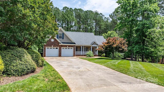 5362 Beacon Ridge Dr, Granite Falls, NC 28630 - view of front of property featuring concrete driveway, a porch, brick siding, a front yard, and view of wooded area
