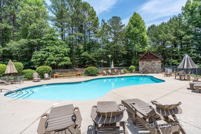5362 Beacon Ridge Dr, Granite Falls, NC 28630 - community pool with a patio and view of wooded area