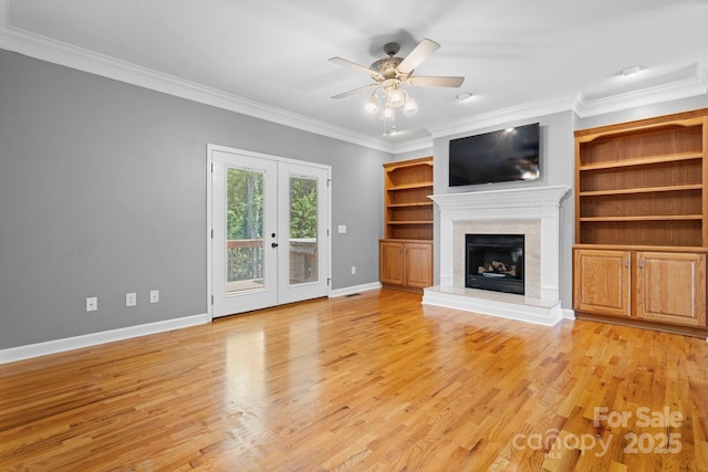 5362 Beacon Ridge Dr, Granite Falls, NC 28630 - unfurnished living room with ornamental molding, ceiling fan, light wood-style flooring, french doors, and baseboards