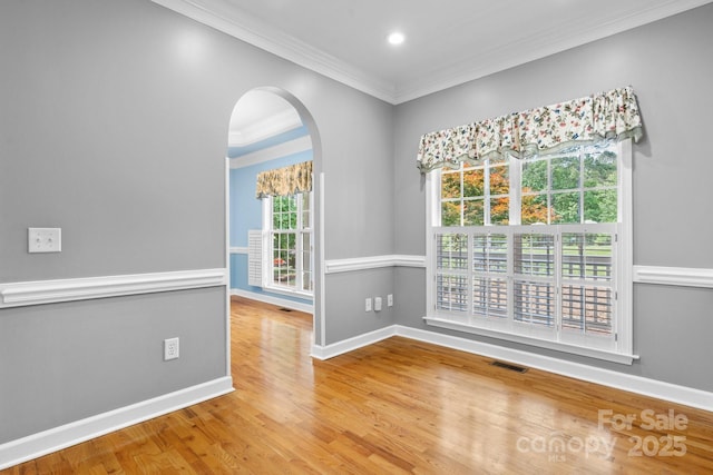 5362 Beacon Ridge Dr, Granite Falls, NC 28630 - empty room with ornamental molding, baseboards, arched walkways, wood finished floors, and recessed lighting