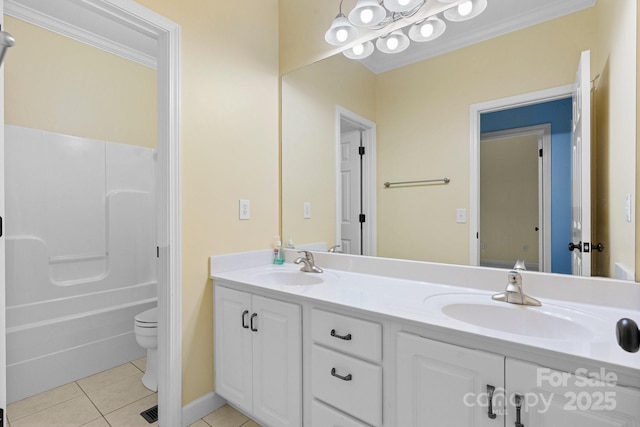 5362 Beacon Ridge Dr, Granite Falls, NC 28630 - bathroom featuring tile patterned flooring, double vanity, toilet, crown molding, and baseboards