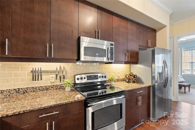 4620 Piedmont Row Dr Unit 308, Charlotte, NC 28210 - kitchen with stainless steel appliances, crown molding, light stone countertops, dark wood finished floors, and decorative backsplash