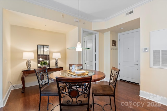 4620 Piedmont Row Dr Unit 308, Charlotte, NC 28210 - dining area with wood finished floors, crown molding, and baseboards