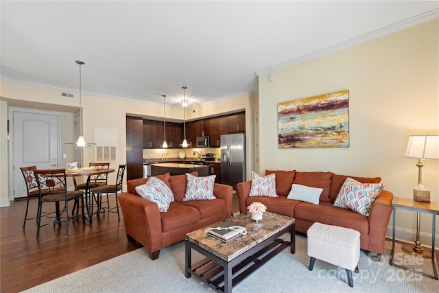 4620 Piedmont Row Dr Unit 308, Charlotte, NC 28210 - living room with wood finished floors, crown molding, and baseboards