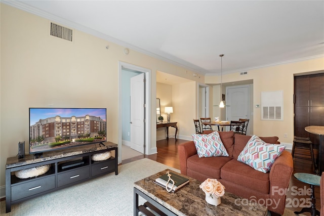 4620 Piedmont Row Dr Unit 308, Charlotte, NC 28210 - living room with crown molding and baseboards