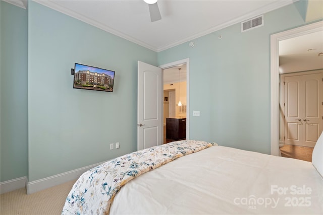 4620 Piedmont Row Dr Unit 308, Charlotte, NC 28210 - carpeted bedroom featuring crown molding, baseboards, and a ceiling fan