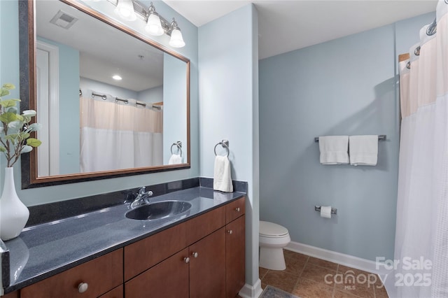 4620 Piedmont Row Dr Unit 308, Charlotte, NC 28210 - bathroom with vanity, toilet, baseboards, tile patterned flooring, and curtained shower