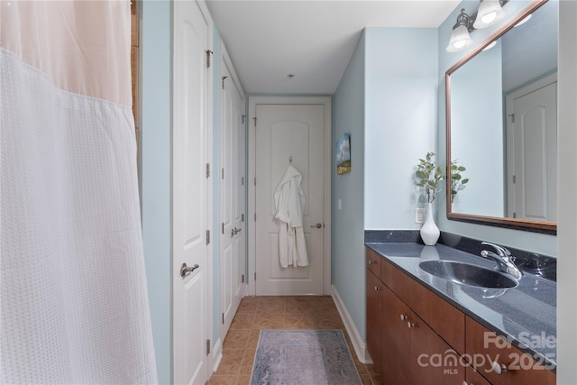 4620 Piedmont Row Dr Unit 308, Charlotte, NC 28210 - full bathroom featuring vanity, baseboards, tile patterned flooring, and a shower with curtain