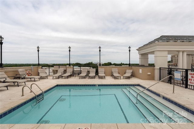 4620 Piedmont Row Dr Unit 308, Charlotte, NC 28210 - community pool featuring a patio area