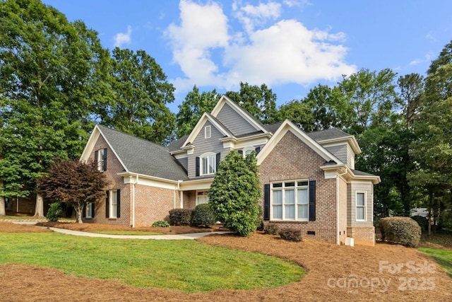 9219 Whispering Wind Dr, Charlotte, NC 28277 - craftsman-style house with brick siding, a front yard, crawl space, and a shingled roof