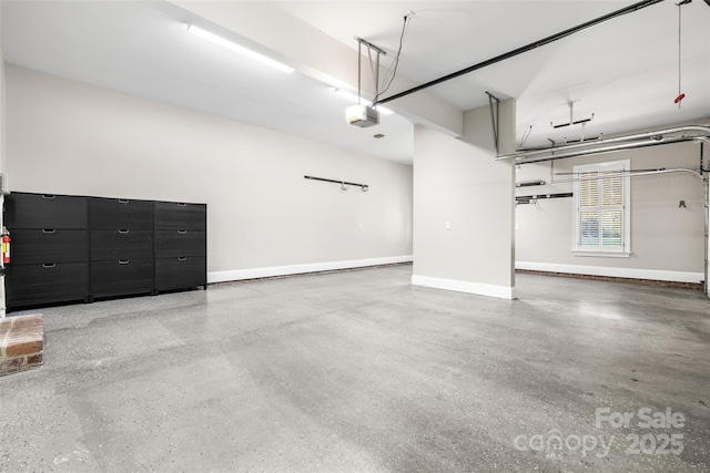 9219 Whispering Wind Dr, Charlotte, NC 28277 - garage featuring a garage door opener and baseboards