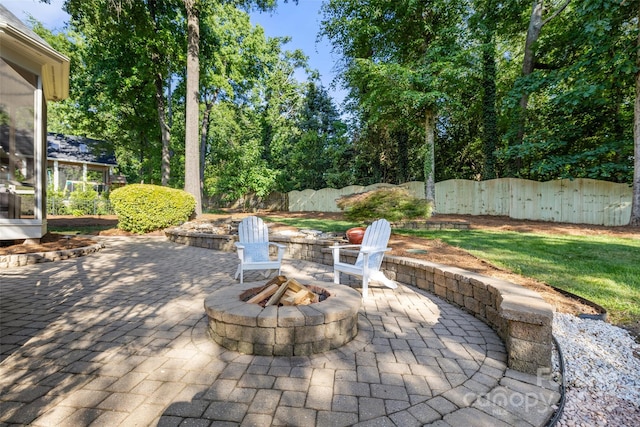 9219 Whispering Wind Dr, Charlotte, NC 28277 - view of patio with a fire pit and a sunroom