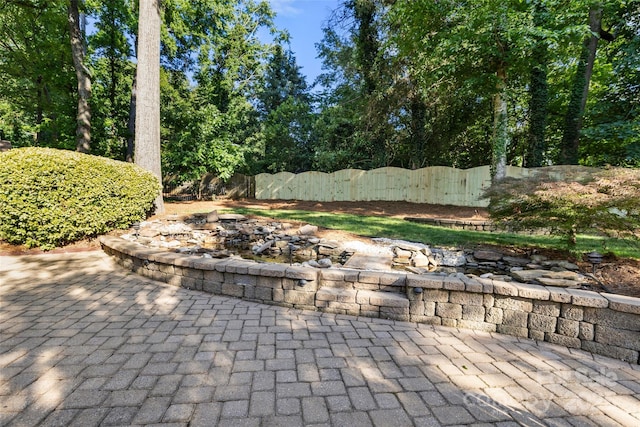 9219 Whispering Wind Dr, Charlotte, NC 28277 - view of patio / terrace with a fire pit