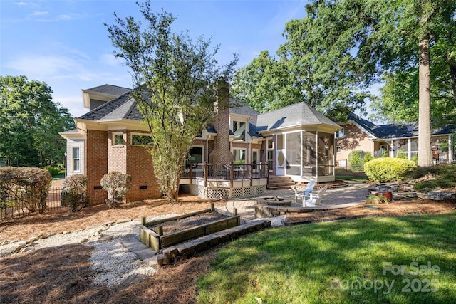9219 Whispering Wind Dr, Charlotte, NC 28277 - back of house featuring a sunroom, a patio area, brick siding, a deck, and roof with shingles