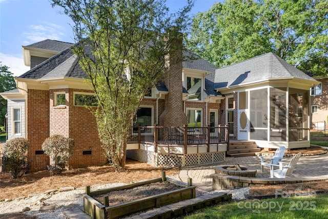 9219 Whispering Wind Dr, Charlotte, NC 28277 - rear view of property with an outdoor fire pit, a sunroom, brick siding, a deck, and a patio