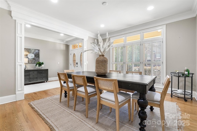 9219 Whispering Wind Dr, Charlotte, NC 28277 - dining area with ornamental molding, baseboards, light wood-type flooring, and recessed lighting