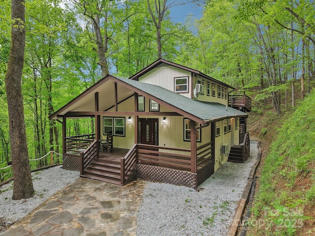 291 Dills Rd, Bryson City, NC 28713 - chalet / cabin with a shingled roof and covered porch