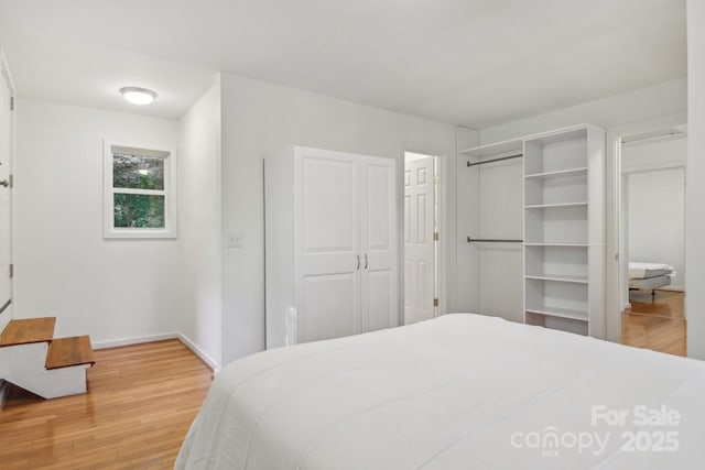 291 Dills Rd, Bryson City, NC 28713 - bedroom with light wood-type flooring and baseboards