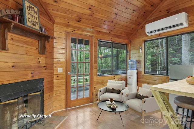 291 Dills Rd, Bryson City, NC 28713 - living area with a wall mounted air conditioner, vaulted ceiling, wooden walls, wood finished floors, and wood ceiling