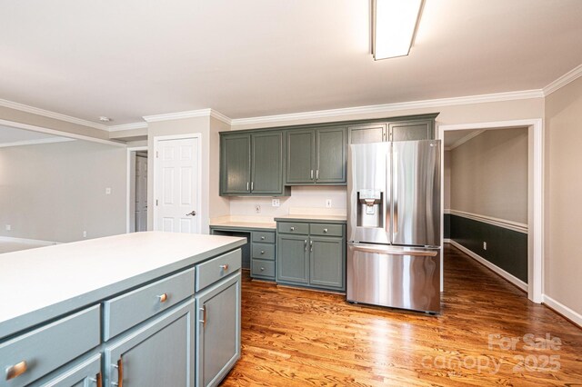 2728 Touchstone Cir, Newton, NC 28658 - kitchen featuring stainless steel fridge, ornamental molding, light wood-style floors, light countertops, and baseboards