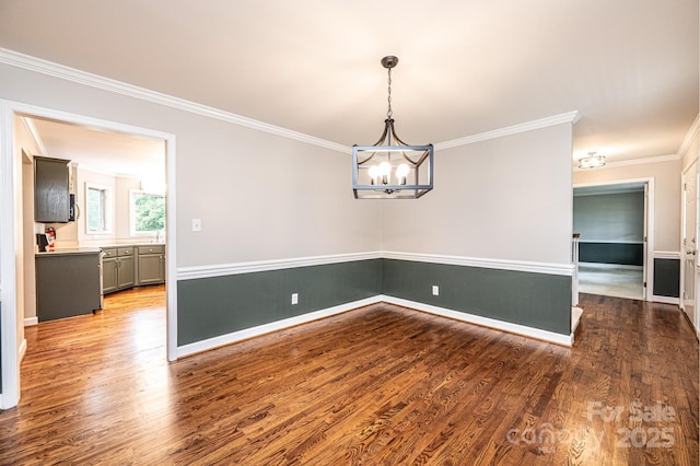 2728 Touchstone Cir, Newton, NC 28658 - empty room with a chandelier, wood finished floors, crown molding, and baseboards