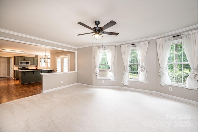 2728 Touchstone Cir, Newton, NC 28658 - unfurnished living room with dark colored carpet, crown molding, plenty of natural light, baseboards, and a ceiling fan