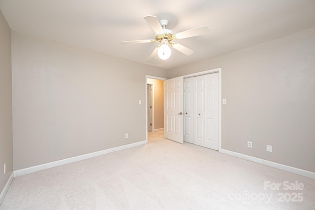 2728 Touchstone Cir, Newton, NC 28658 - unfurnished bedroom featuring baseboards, light carpet, a closet, and a ceiling fan