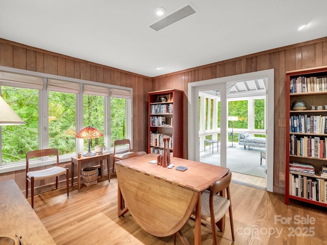 185 Greenstoke Loop, Tryon, NC 28782 - dining area featuring wood walls, an office area, and light wood-type flooring