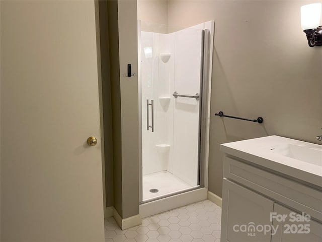 185 Greenstoke Loop, Tryon, NC 28782 - full bathroom with a stall shower, vanity, baseboards, and tile patterned floors
