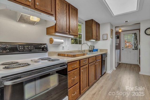 619 Beaverdam Rd, Asheville, NC 28804 - kitchen with range with electric cooktop, under cabinet range hood, dishwasher, a sink, and brown cabinets