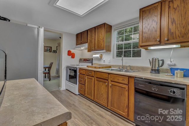 619 Beaverdam Rd, Asheville, NC 28804 - kitchen with white electric stove, black dishwasher, freestanding refrigerator, a sink, and light countertops