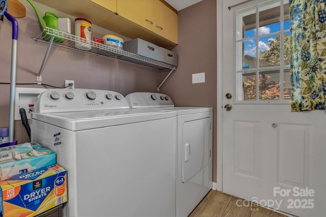 619 Beaverdam Rd, Asheville, NC 28804 - laundry room featuring washing machine and dryer and light wood-style flooring