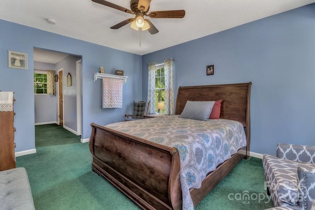 619 Beaverdam Rd, Asheville, NC 28804 - carpeted bedroom with baseboards, multiple windows, and ceiling fan
