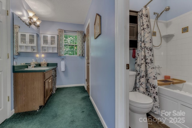 619 Beaverdam Rd, Asheville, NC 28804 - bathroom with vanity, shower / bath combo with shower curtain, toilet, a textured ceiling, and baseboards