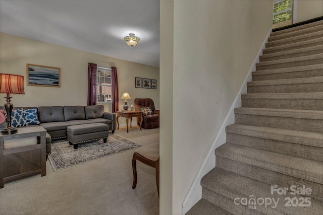 619 Beaverdam Rd, Asheville, NC 28804 - living area with carpet, stairs, healthy amount of natural light, and baseboards
