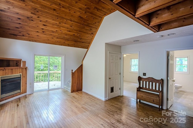 680 Timberlane Dr, Boone, NC 28607 - living area featuring stairs, baseboards, wood-type flooring, a glass covered fireplace, and high vaulted ceiling