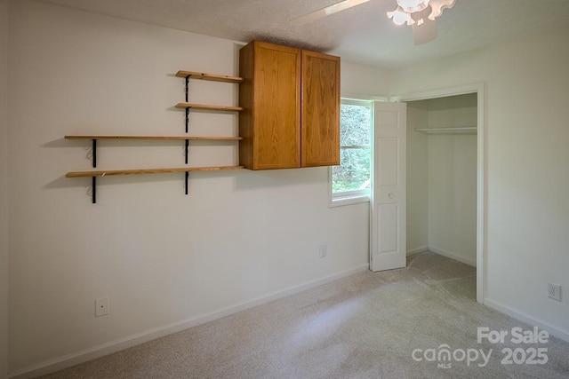 680 Timberlane Dr, Boone, NC 28607 - unfurnished bedroom featuring light carpet, baseboards, a ceiling fan, and a closet