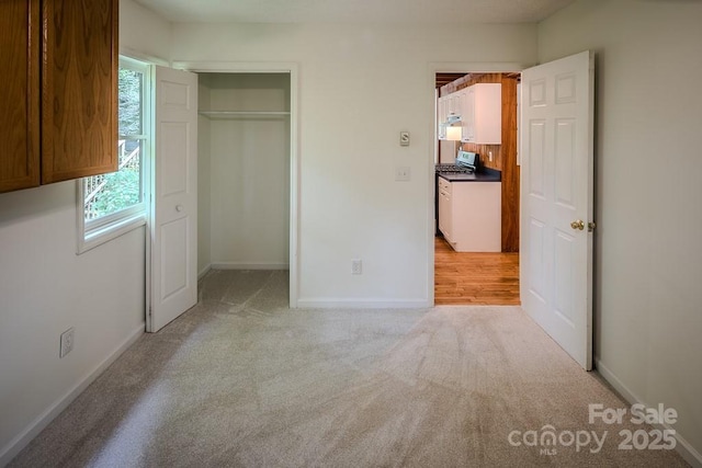680 Timberlane Dr, Boone, NC 28607 - unfurnished bedroom featuring light carpet, baseboards, and a closet