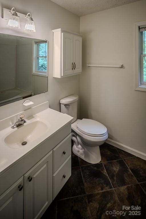 680 Timberlane Dr, Boone, NC 28607 - full bath featuring vanity, toilet, tile patterned floors, baseboards, and a textured ceiling