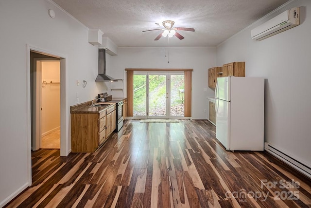 680 Timberlane Dr, Boone, NC 28607 - kitchen featuring freestanding refrigerator, a wall mounted air conditioner, stainless steel range with electric stovetop, wall chimney range hood, and a baseboard heating unit