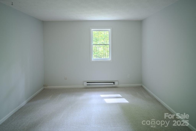 680 Timberlane Dr, Boone, NC 28607 - unfurnished room featuring a baseboard radiator, carpet, and baseboards