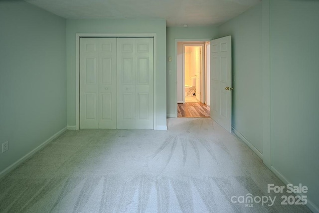 680 Timberlane Dr, Boone, NC 28607 - unfurnished bedroom with a closet, baseboards, and carpet floors
