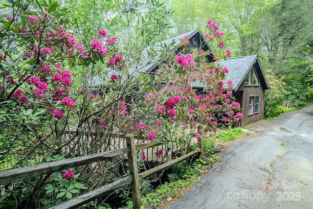 680 Timberlane Dr, Boone, NC 28607 - view of home's exterior featuring a shingled roof and driveway