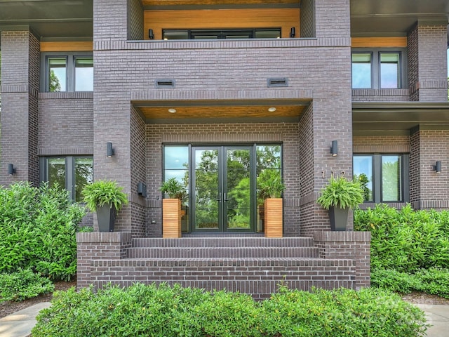 112 Manning Dr, Charlotte, NC 28209 - entrance to property featuring french doors, brick siding, and a balcony